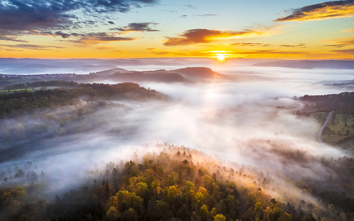 Germany, Baden-Wurttemberg, Drone view of Remstal valley at foggy sunrise