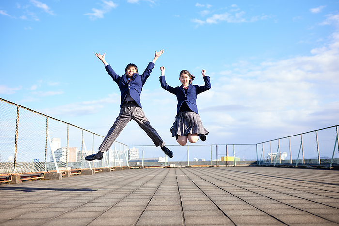 Japanese junior high school students jumping on the rooftop
