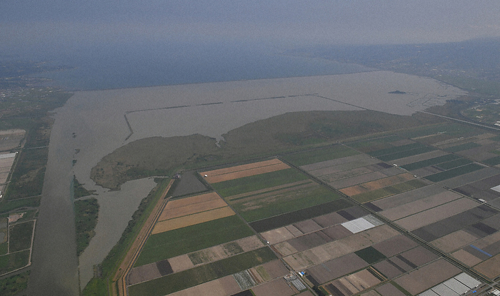 Isahaya Bay reclaimed land. Tidal embankment in the rear. Isahaya Bay reclaimed land. Tide receiving embankment in the rear, photographed by Kimiya Tanabe from the head office helicopter at 11:49 a.m. on September 13, 2019, in Isahaya, Nagasaki Prefecture.