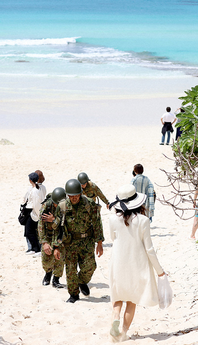 Missing land based helicopter, search continues. Self Defense Forces personnel search for the crew of a missing Ground Self Defense Force helicopter, including the area around a beach where tourists gather, in Miyakojima City, Okinawa Prefecture, April 9, 2023.