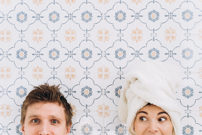 A guy and a girl with a towel on their heads, surprised faces