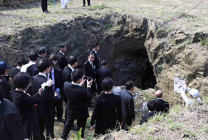 Memorial service for the war dead on Iwo Jima Officials look at the site where remains are being collected on Iwo Jima in Ogasawara Village, Tokyo, Japan, at 2:32 p.m. on March 25, 2023  representative photo .
