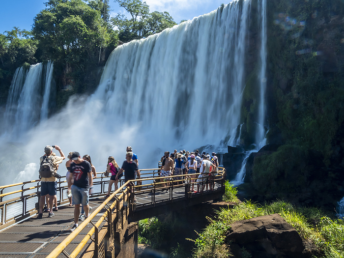 Tourists on a platform on the lower circuit at Iguaz  Falls, Misiones Province, Argentina. Tourists on a platform on the lower circuit at Iguazu Falls, UNESCO World Heritage Site, Misiones Province, Argentina, South America, by Michael Nolan