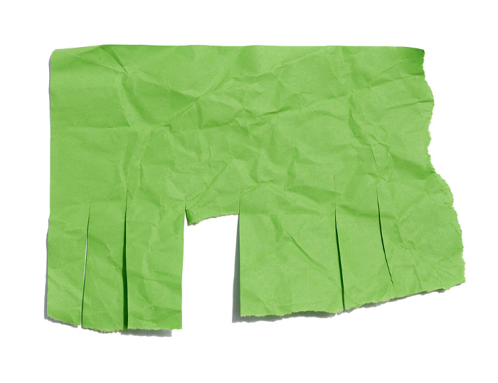 Green sheet of paper with torn edges for writing an ad on a white isolated background Green sheet of paper with torn edges for writing an ad on a white isolated background