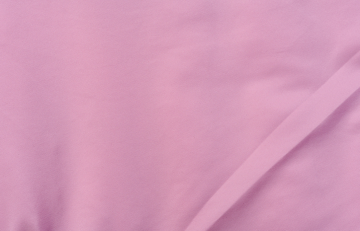 Fragment of pink silk fabric, full frame Fragment of pink silk fabric, full frame