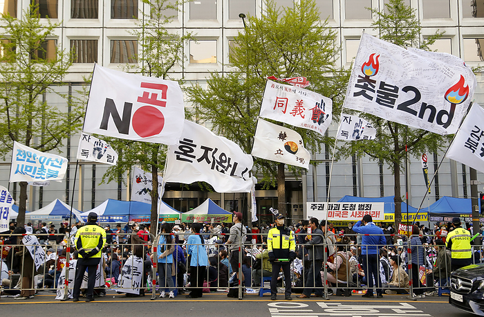 Protest demanding the resignation of South Korean President Yoon Suk Yeol in Seoul Demo demanding the resignation of Korean President Yoon, Apr 15, 2023 : Flags are seen during a protest rally demanding the resignation of South Korean President Yoon Suk Yeol in Seoul, South Korea. A flag  top L  stands for,  No Japan, No Yoon Suk Yeol, who is a pro Japan traitor to South Korea . Thousands of protesters marched through central Seoul on Saturday. President Yoon s approval rating reached a five month low on April 17 amid accusations of  giveaways  at a recent summit with Japan and allegations that the CIA intercepted communications by senior officials with the South Korean National Security Office, local media reported.   Photo by Lee Jae Won AFLO   SOUTH KOREA 
