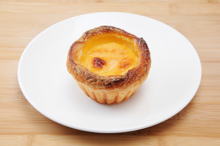 Egg cheese tart on a plate French pastry table