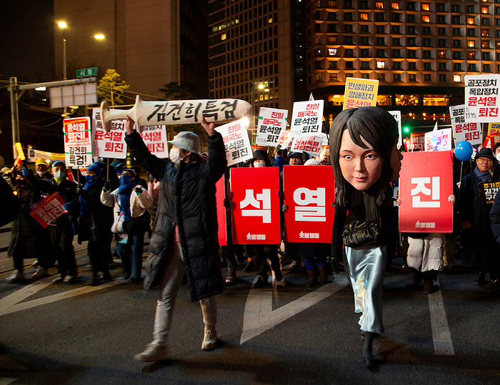 Anti Japan and anti Yoon Suk Yeol protest in Seoul Demonstration demanding the resignation of South Korean President Yoon Suk Yeol, Feb 4, 2023 : A protester wearing a mask featuring facial plastic surgeries of South Korean first lady Kim Keon Hee, attends an anti Japan and anti Yoon Suk Yeol protest in central Seoul, South Korea. Korean characters  front L  read, Organize a special prosecution to investigate Kim Keon Hee . Pickets read,  Yoon Suk Yeol Resign . Thousands of protesters marched through central Seoul as they demanded the resignation of President Yoon.  Photo by Lee Jae Won AFLO   SOUTH KOREA 