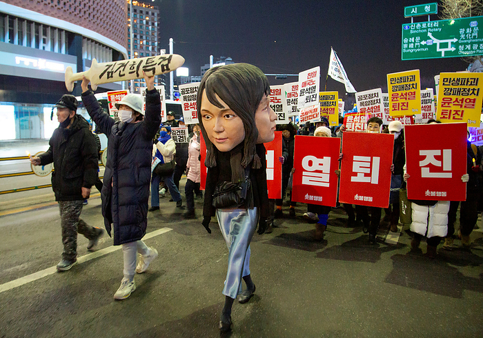Anti Japan and anti Yoon Suk Yeol protest in Seoul Demonstration demanding the resignation of South Korean President Yoon Suk Yeol, Feb 4, 2023 : A protester wearing a mask featuring facial plastic surgeries of South Korean first lady Kim Keon Hee, attends an anti Japan and anti Yoon Suk Yeol protest in central Seoul, South Korea. Korean characters  front L  read, Organize a special prosecution to investigate Kim Keon Hee . Pickets read,  Yoon Suk Yeol Resign . Thousands of protesters marched through central Seoul as they demanded the resignation of President Yoon.  Photo by Lee Jae Won AFLO   SOUTH KOREA 