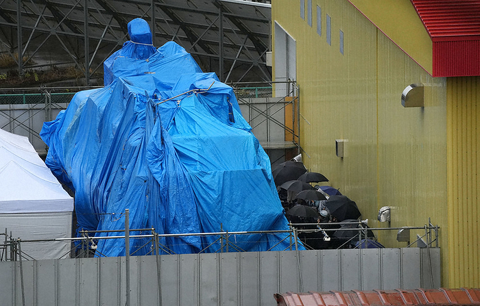 One year since the Shiretoko sightseeing boat accident Families of victims get a close up look at  KAZU I  covered by a blue sheet in the rain, April 23, 2023, in Abashiri, Japan.