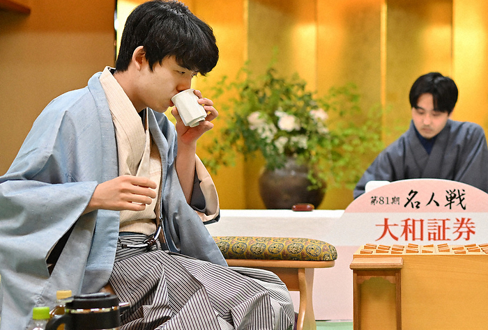 The 81st Meijin Tournament   7th game, Round 2, Day 1 Challenger Sota Fujii, Osho, looks at the board while drinking tea during the second game of the 81st Meijin Tournament.