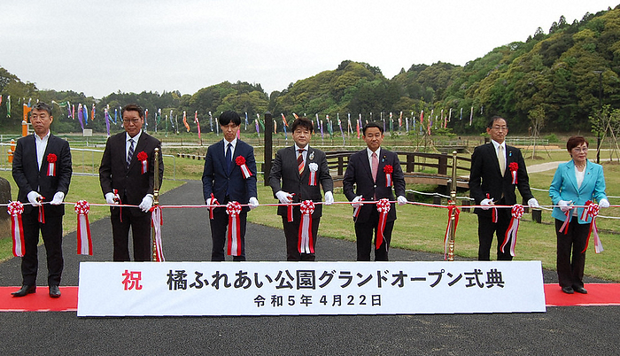 Mayor Tomonori Ito and others cutting the ribbon at the grand opening ceremony of Tachibana Fureai Park Mayor Tomonori Ito  center  and others cut the ribbon at the grand opening ceremony of Tachibana Fureai Park in Katori City at 10:28 a.m. on April 22, 2023  photo by Mitsuo Koga .