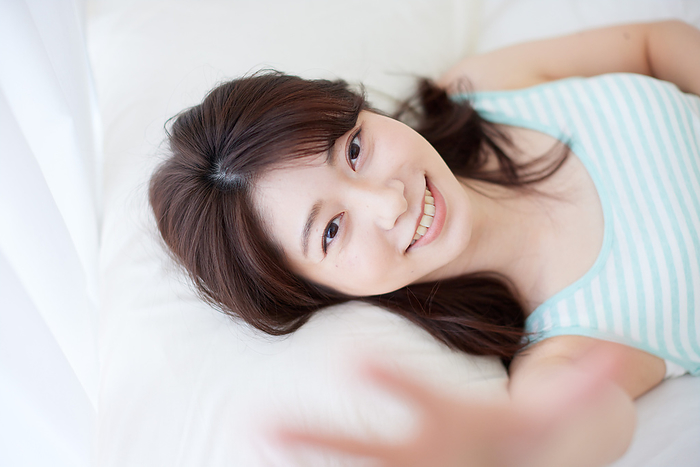 Japanese woman relaxing in bed