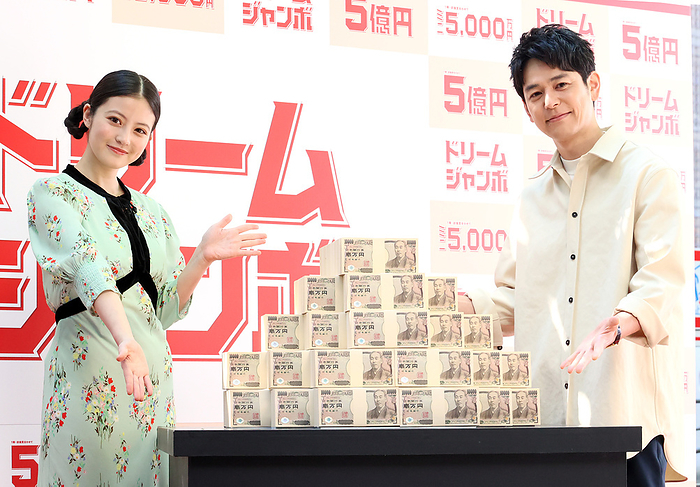 The first ticket of the Dream Jumbo Lottery goes on sale May 2, 2023, Tokyo, Japan   Japanese actor Satoshi Tsumabuki  R  and actress Mio Imada  L  display 500 million yen bank notes as they attend a promotional event of the Dream Jumbo Lottery for the first ticket goes on sale in Tokyo on Tuesday, May 2, 2023. Thousands of punters queued up for tickets in the hope of becoming a billionaire.     photo by Yoshio Tsunoda AFLO 