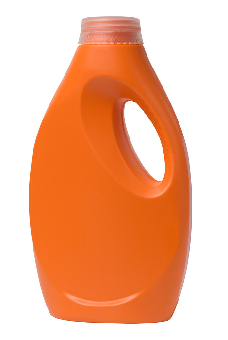 Orange plastic bottle for liquid detergents, for washing clothes on a white background Orange plastic bottle for liquid detergents, for washing clothes on a white background