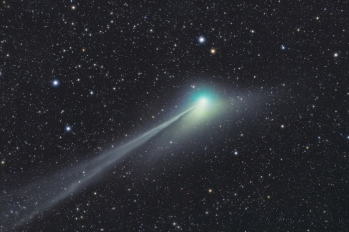 Comet 2022 E3  ZTF  Comet C 2022 E3  ZTF  as it passed the Earth on the 19th January 2023. Discovered on the 2nd March 2022, C 2022 E3  ZTF  is a long period comet originating from the Oort cloud, which is approximately 149 billion kilometres away from our Sun. The comet gets its characteristic green glow from the ejection of diatomic carbon and cyanogen from its nucleus to the coma  atmosphere  as it is heated by the Sun. The comet has two tails  left , one composed of dust and the other composed of gas ionised by ultraviolet radiation, causing it to glow. Along with its two tails, the comet possesses a third anti tail going towards the Sun  right , which is attributed to an optical illusion only observed for a brief interval when the Earth passes through the comet s orbital plane. Photographed from the Dark Sky Alqueva Observatory, Portugal, between the constellations of Hercules, Corona Borealis and Bootes., by MIGUEL CLARO SCIENCE PHOTO LIBRARY