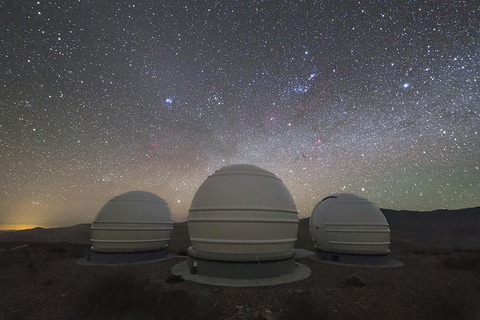 ExTrA telescopes at night, Chile Exoplanets in Transits and their Atmospheres  ExTrA  telescopes at night. Visible in the sky is Orion  right of centre  and the Pleiades star cluster  left of centre . The ExTrA project in La Silla, Chile, is a series of three 60 cm telescopes searching for Earth sized worlds around stars of a kind known as M dwarfs. These stars were selected because of their small size, which makes it easier to detect orbiting planets via the transit method  a transiting planet will block a greater fraction of the light from a smaller star., by ESO PETR HORALEK SCIENCE PHOTO LIBRARY