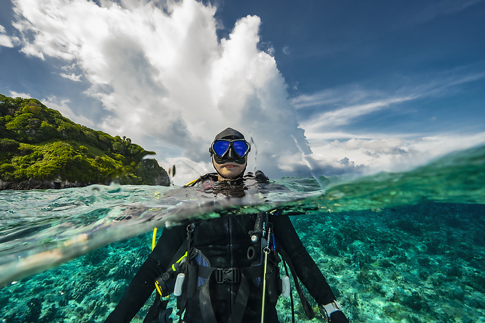 Diver surfacing in the tropical waters of the Banda Sea