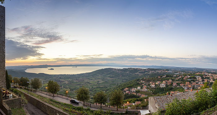 Scenic view of lake and Montefiascone town at sunset