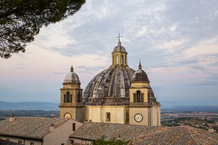 Architectural dome of Basilica Di Santa Margherita under cloudy sky
