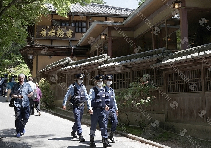 Iwasou, a long established ryokan where the G7 Hiroshima Summit Dinner will soon be held Police officers patrol the area around the long established inn  Iwasou  in Hatsukaichi, Hiroshima Prefecture, May 14, 2023.