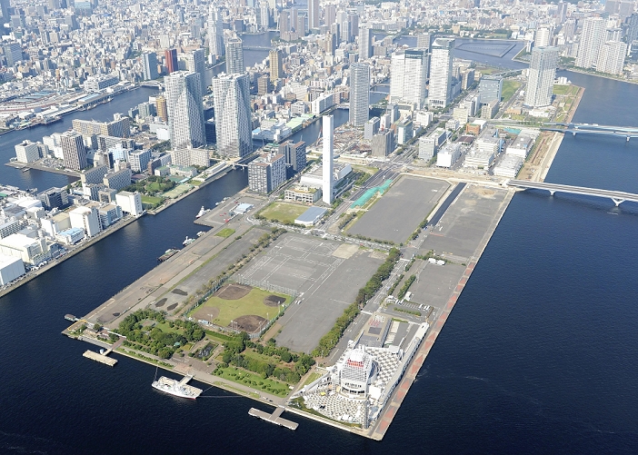 Aerial view of the Harumi waterfront area, Harumi, Tokyo, where the 2020 Tokyo Olympics Athletes  Village is scheduled to be built. Land prices are expected to rise in the waterfront area of Harumi, Chuo ku, Tokyo, where the athletes  village for the 2020 Tokyo Olympics is scheduled to be built. The July 1 base land price figures clearly show that land prices in metropolitan areas have bottomed out, reflecting a recovery in corporate earnings and an increase in housing demand due to the effects of the Abe administration s  Abenomics  economic policy. Some believe that the hosting of the Tokyo Olympics and Paralympics in 2008 will further boost land prices in the metropolitan area. The photo was taken on September 13, 2013, from a helicopter over Tokyo s Chuo Ward. The photo was taken on September 13, 2013 and published in the morning edition of the same month  Metropolitan Areas Recovering, Land Prices Leading the Rise with the Olympics .