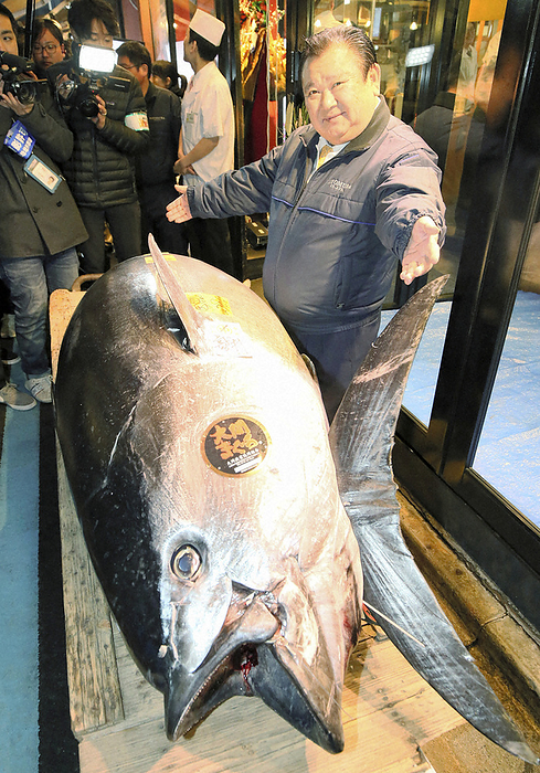First auction at Toyosu Market in 2019: 330 million yen for the best tuna President Kiyoshi Kimura poses in front of fresh tuna he auctioned off in Chuo ku, Tokyo, January 5, 2019.