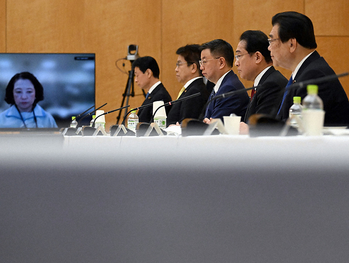 Conference for the Realization of New Capitalism Prime Minister Fumio Kishida  second from right  speaks at the Conference for the Realization of New Capitalism. In the back left screen is Tomoko Yoshino, President of RENGO  Japanese Trade Union Confederation , at the Prime Minister s Office, May 16, 2023, 5:52 p.m.  photo by Mikiharu Takeuchi.