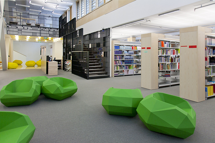 Tartu Healthcare College,Estonia,A healthcare college library with open spaces, green chairs and book stacks. A modern light and airy building. A healthcare college library with open spaces, green chairs and book stacks. A modern light and airy building.