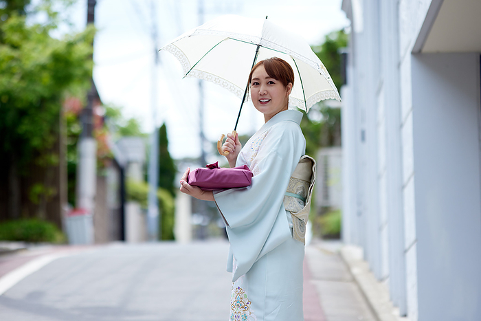 Japanese woman in kimono holding a furoshiki wrapping cloth