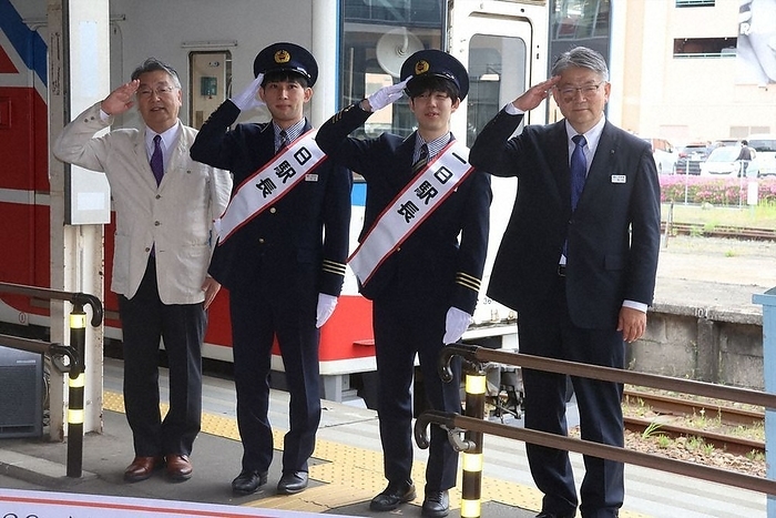 Rokkan Fujii and others become stationmaster for a day at Sanriku Railway Sota Fujii 6 kan  second from right  and Reo Koyama 4 dan  third from right  pose in salute at the appointment ceremony for the one day station chief in Miyako City, Iwate Prefecture, Japan.