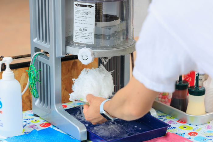 Man's hand making shaved ice