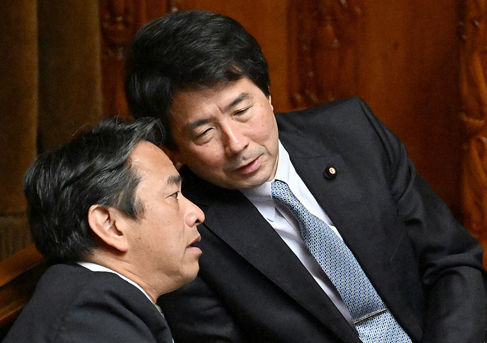 Plenary Session of the House of Councillors Kouhei Otsuka, chairman of the tax commission, exchanges words with Katsuya Haruha, secretary general of the National Democratic Party of Japan  left , before a plenary session of the upper house of the Diet on June 7, 2023, at 10:01 a.m.