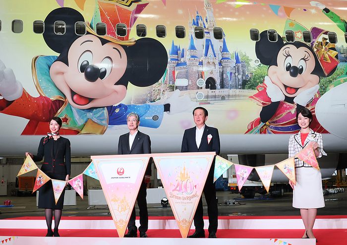 JAL unveils specially painted aircraft for Tokyo Disney Resort s 40th anniversary June 9, 2023, Tokyo, Japan   Japan Airlines  JAL  president Yuji Akasaka  2nd L  and Tokyo Disney Resort operator Oriental Land president Kenji Yoshida  2nd R  with their employees display the  JAL Colorful Dreams Express  jetliner to celebrate the Disneyland s 40th anniversary at a JAL hangar at the Haneda airport in Tokyo on Friday, June 9, 2023. The new Disney characters designed Boeing 767 launched JAL s domestic routes.     photo by Yoshio Tsunoda AFLO  