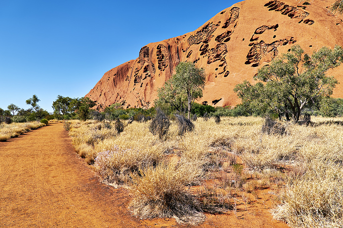 Hiking around Uluru Ayers Rock. Northern Territory. Australia Hiking around Uluru Ayers Rock. Northern Territory. Australia, by Zoonar Marco Brivio