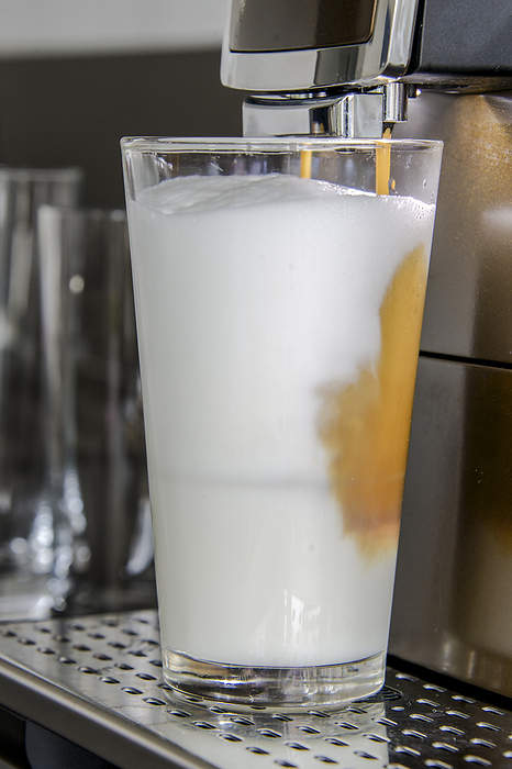 a latte macchiato is prepared a latte macchiato is prepared, by Zoonar Lars Zahner