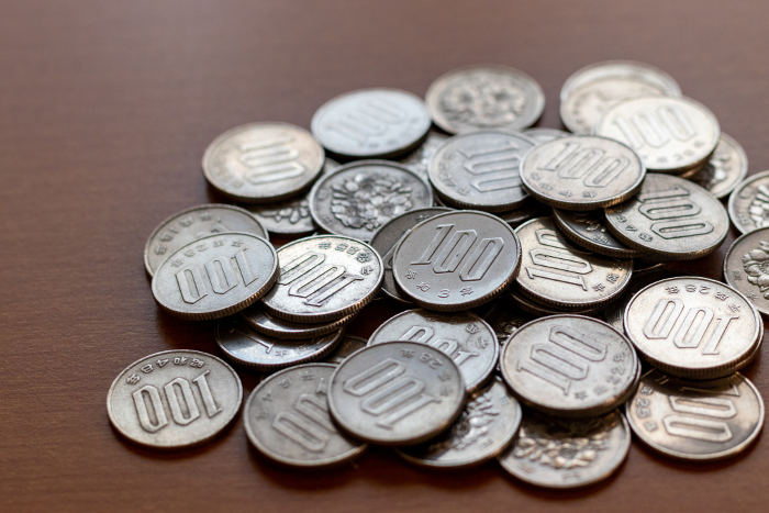Piles of 100 yen coins