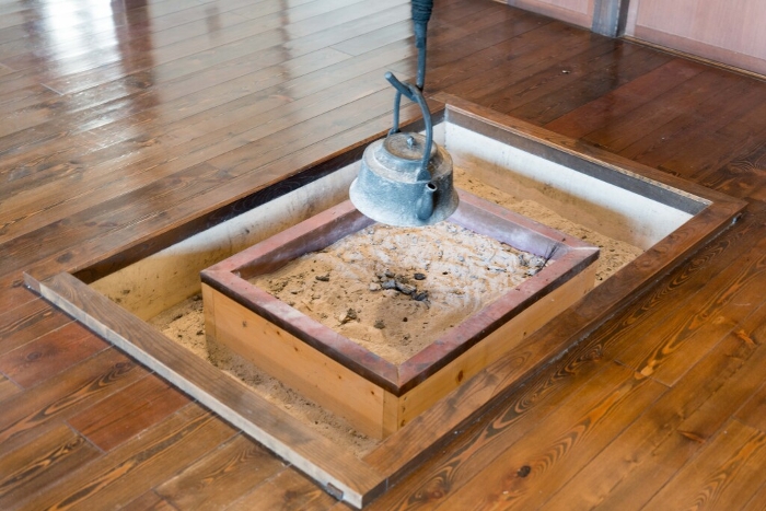Irori (sunken hearth) set in a wooden room