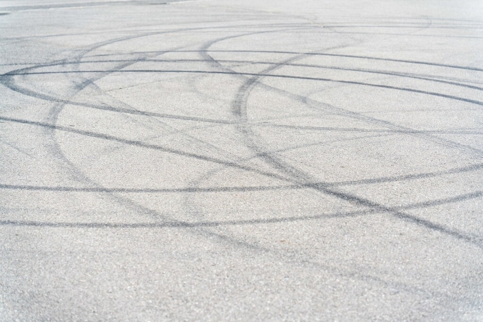 Tire tracks on parking lot