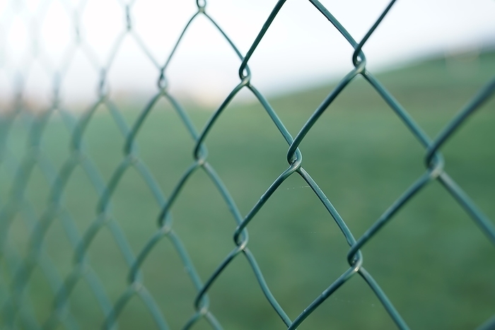 Wire mesh fence on a private land Wire mesh fence on a private land, by Zoonar Heiko Kueverl