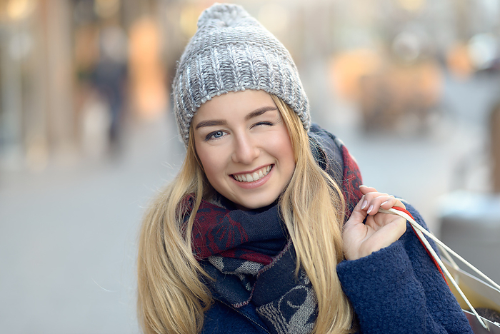 Gorgeous young woman out Christmas shopping Gorgeous young woman out Christmas shopping, by Zoonar Lars Zahner