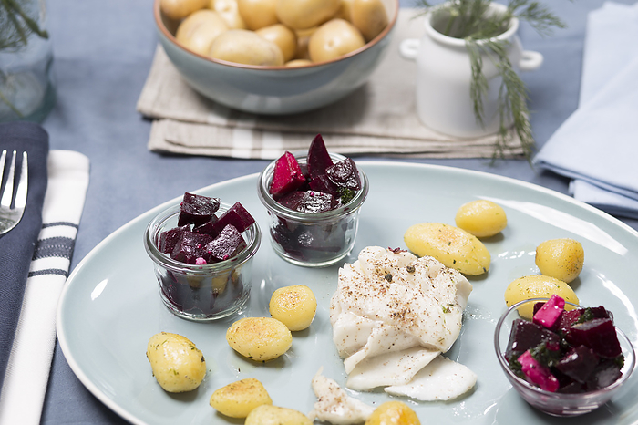 Roasted cod fillet with roast potatoes and beetroot salad Roasted cod fillet with roast potatoes and beetroot salad, by Zoonar Dieter Meyer