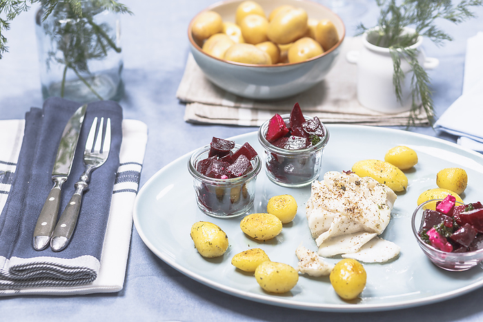 Roasted cod fillet with roast potatoes and beetroot salad Roasted cod fillet with roast potatoes and beetroot salad, by Zoonar Dieter Meyer