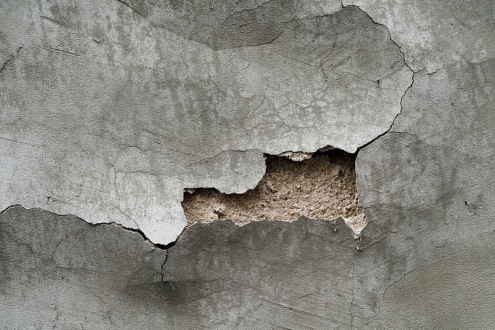 House wall with plaster damage House wall with plaster damage, by Zoonar Heiko Kueverl