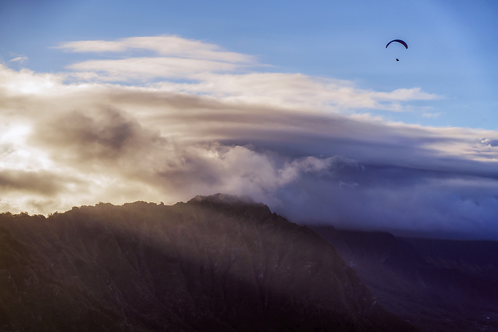 Oahu, Hawaii Paragliding over mountaintops at twilight near Honolulu  Oahu, Hawaii, United States of America, by Ben Horton   Design Pics