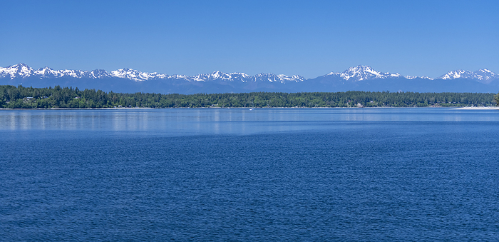 America Olympic Mountains as seen on a clear Summer day about 45 miles from the middle of Budd Inlet in the Puget Sound near Olympia, Washington, USA  Washington, United States of America, by Doug Ogden   Design Pics