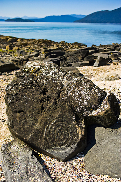 Alaska, U.S.A. Part of a stone petroglyph at Petroglyph Beach in Wrangell, Alaska, USA  Wrangell, Alaska, United States of America, by Michael Melford   Design Pics