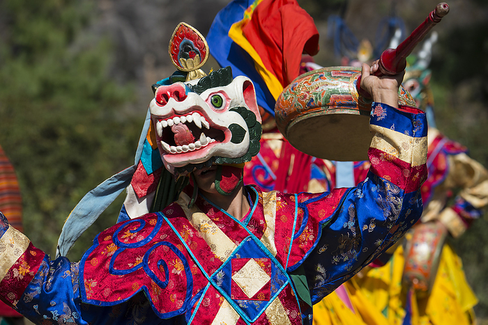 Bhutan Masked participant at dance and music festival in Bhutan  Paro Valley, Bhutan, by Michael Melford   Design Pics