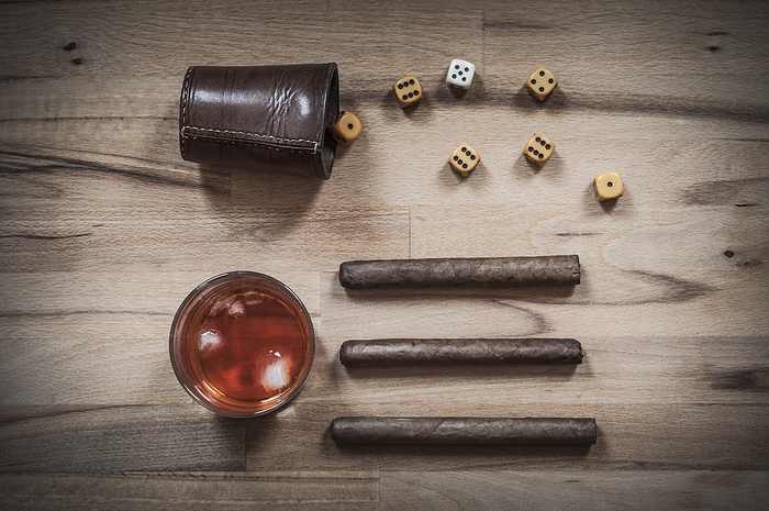 Dice game, cigars and alcoholic beverages Dice game, cigars and alcoholic beverages, by Zoonar Uwe Bauch
