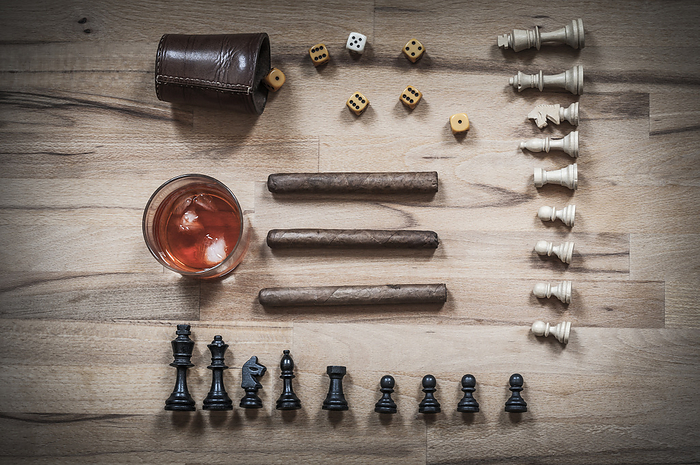 Dice game, chess piece, cigars and alcoholic beverages Dice game, chess piece, cigars and alcoholic beverages, by Zoonar Uwe Bauch